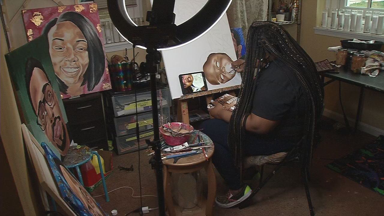 Jaylin Stewart, a local artist, paints in her Louisville studio. She recently completed a painting of Kobe and Gigi Bryant